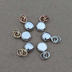 Sterling silver blob pendant with 9ct yellow gold rings