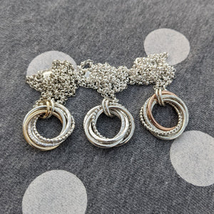 5 ring pendant with 9ct yellow gold beaded ring