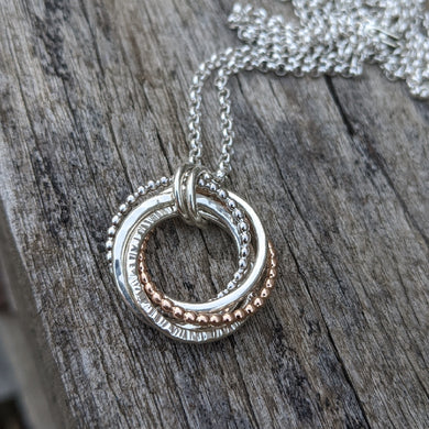 5 ring pendant with 9ct rose gold beaded ring
